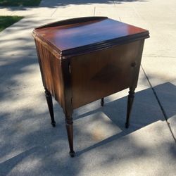 Vintage wooden drop-head sewing machine cabinet or side table hinged top lid can fold out & turned tapered legs