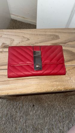Woman’s red guess wallet
