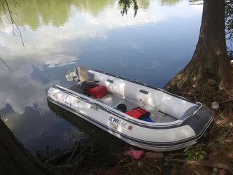 12'6" inflatable Newport Vessel with good running Johnson 15 hp . $1,800 firm