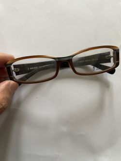 This is a pair of acetate-framed glasses. • Brand/series: There is a treble clef (oint) and the word "MUSIC" on both the temples and the lenses. • Mod