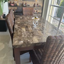 Marble table and 4 wicker chairs