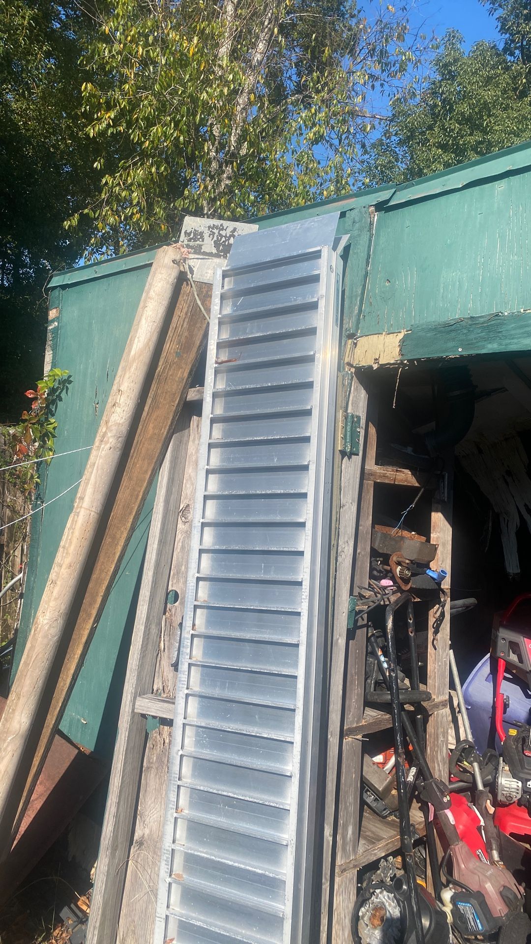 Aluminum folding ramps made by Alcoa 7 foot long two ramps carry like a suitcase big money don’t need them anymore