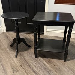 Two black small wood tables