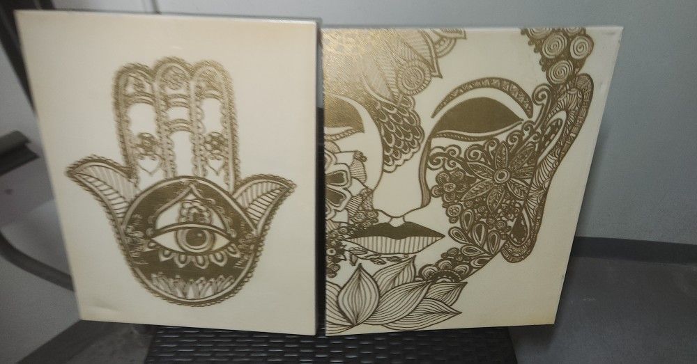 two pieces of decorative art with Buddhist and spiritual themes
