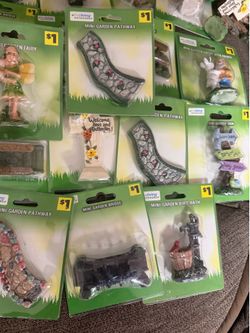 31 True living mini garden figurines. All new