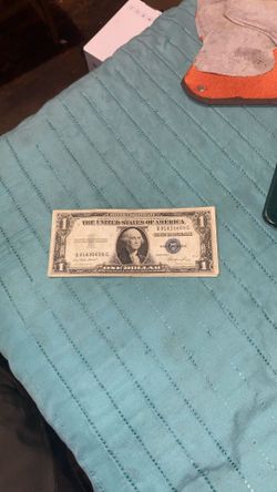 1935 Series $1 Silver Certificate, identifiable by its blue treasury seal and the "Silver Certificate