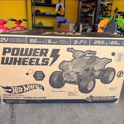 NEW - Hot Wheels Ride-On Toy Racing ATV With Multi-Terrain Traction And Reverse Drive