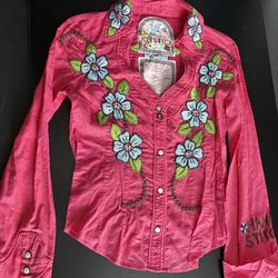 Joystick is a brand often associated with or considered a vintage/earlier line of Johnny Was. Frequently listed as "Joystick by Johnny Was," these pie