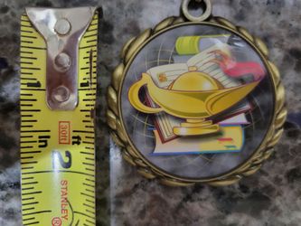lamp of learning medal