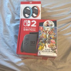 Nintendo Switch 2 with Mario Kart World + Super Smash Bros + Joy-Con Steering Wheel + Extra Storag