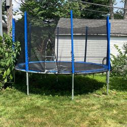 Round Outdoor Trampoline with Safety Net – $150