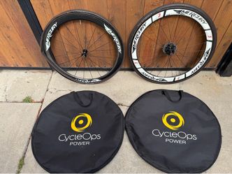 Bike rims Mercury carbon wheels with tires and CycleOps power storage bags. Comes with Dura Ace cog . $300 firm