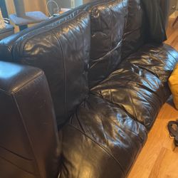 Nice leather couch. Black. Free.