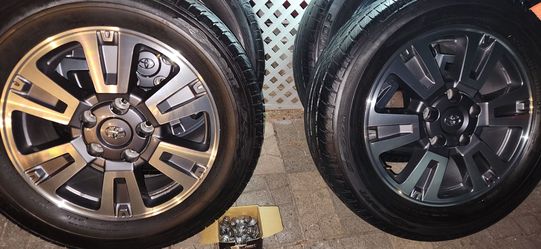 A Set of 4  P275/55 R20 Dunlop Tires W/ Toyota Tundra Rims