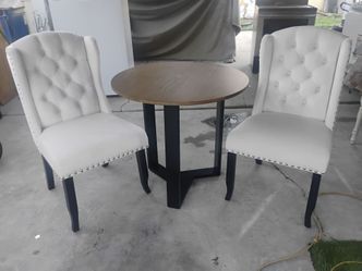 BEAUTIFUL PRACTICALLY NEW TABLE AND CHAIRS