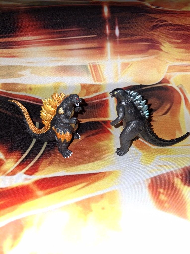 LOT OF 2 GODZILLA 2 INCH TALL FIGURE...UNBRANDED...ADULT OWNED AND KEPT ...