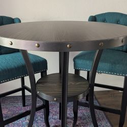 Bar Height Table And Two Upholstered Chairs