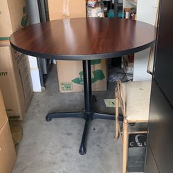 36” round x 28” h table with mahogany laminate top, black metal 4 prong base