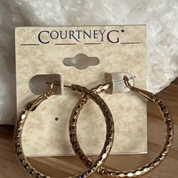 Gold tone textured earrings by Courtney G