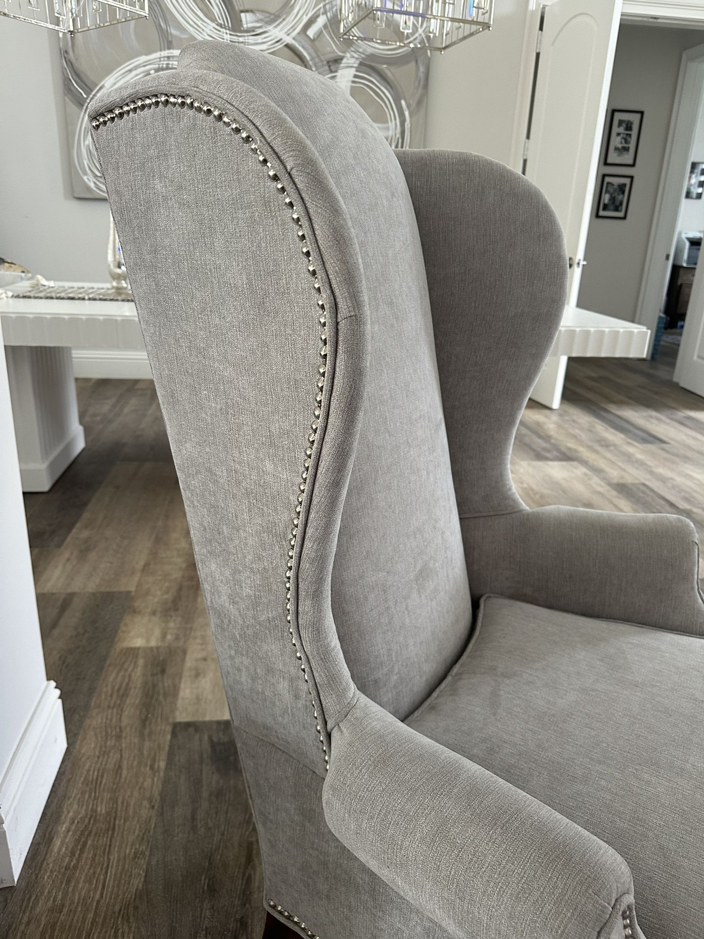 Elegant Wingback Chairs With Chrome Studs 