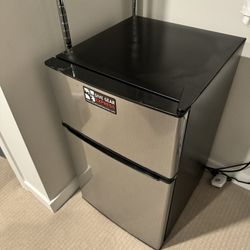 Mini refrigerator with freezer . Like new . Delivery is negotiable