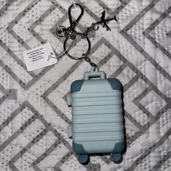 Suitcase hand sanitizer holder