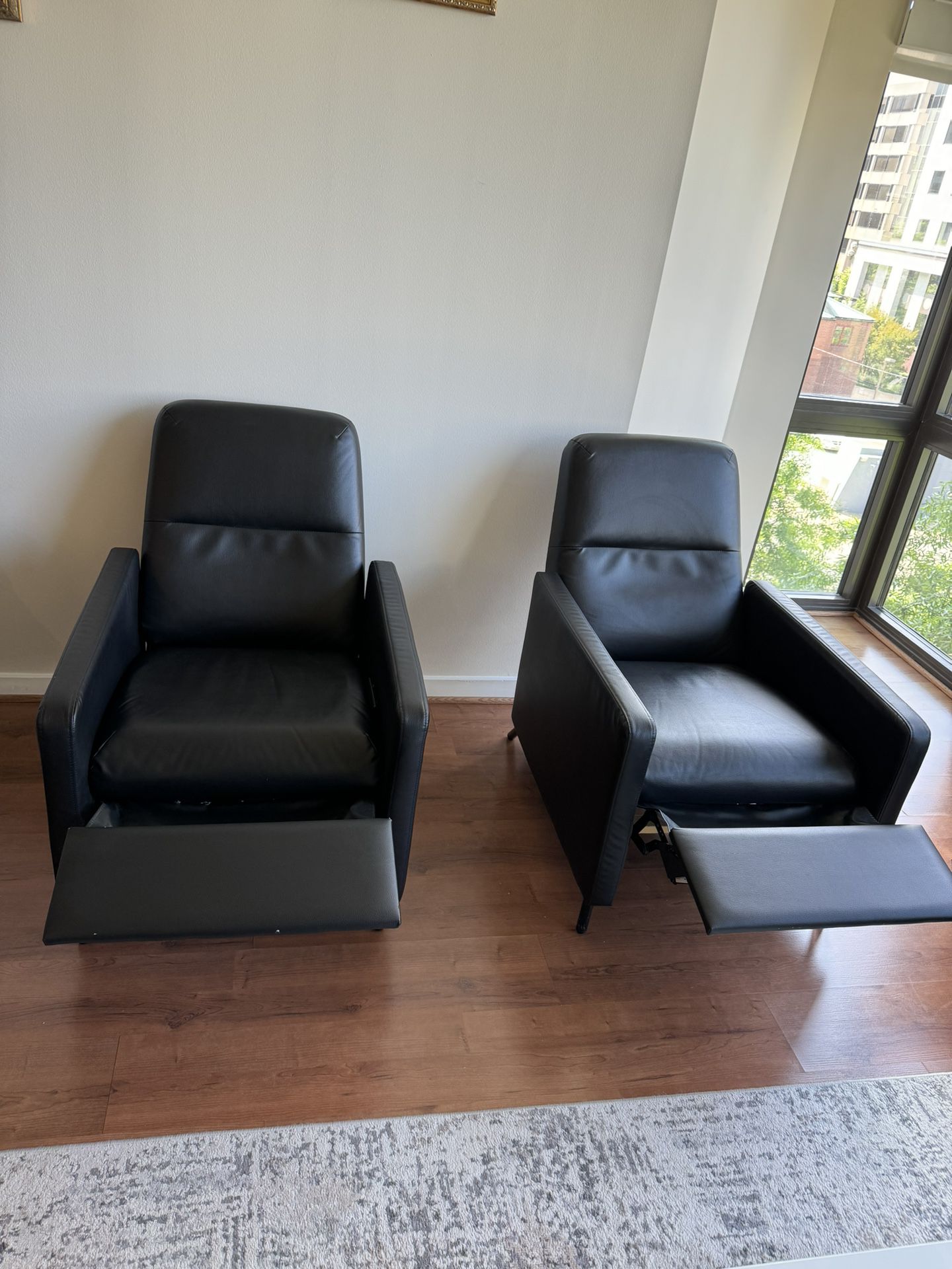 Two Black Leather Recliner Chairs 