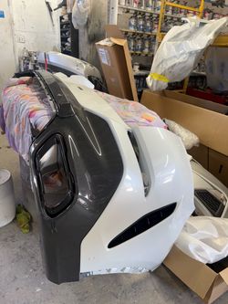 Rear bumper, lower bumper, and impact bar