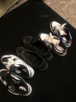 Three pairs of Nike shoes