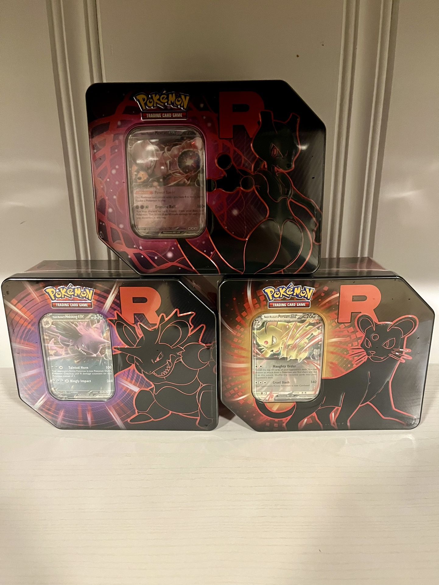 Team Rocket Tins