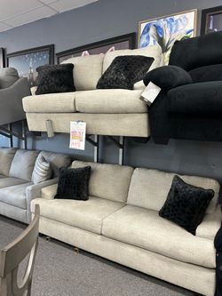 Beige Fabric Three-Seat Sofa with Black Pillows