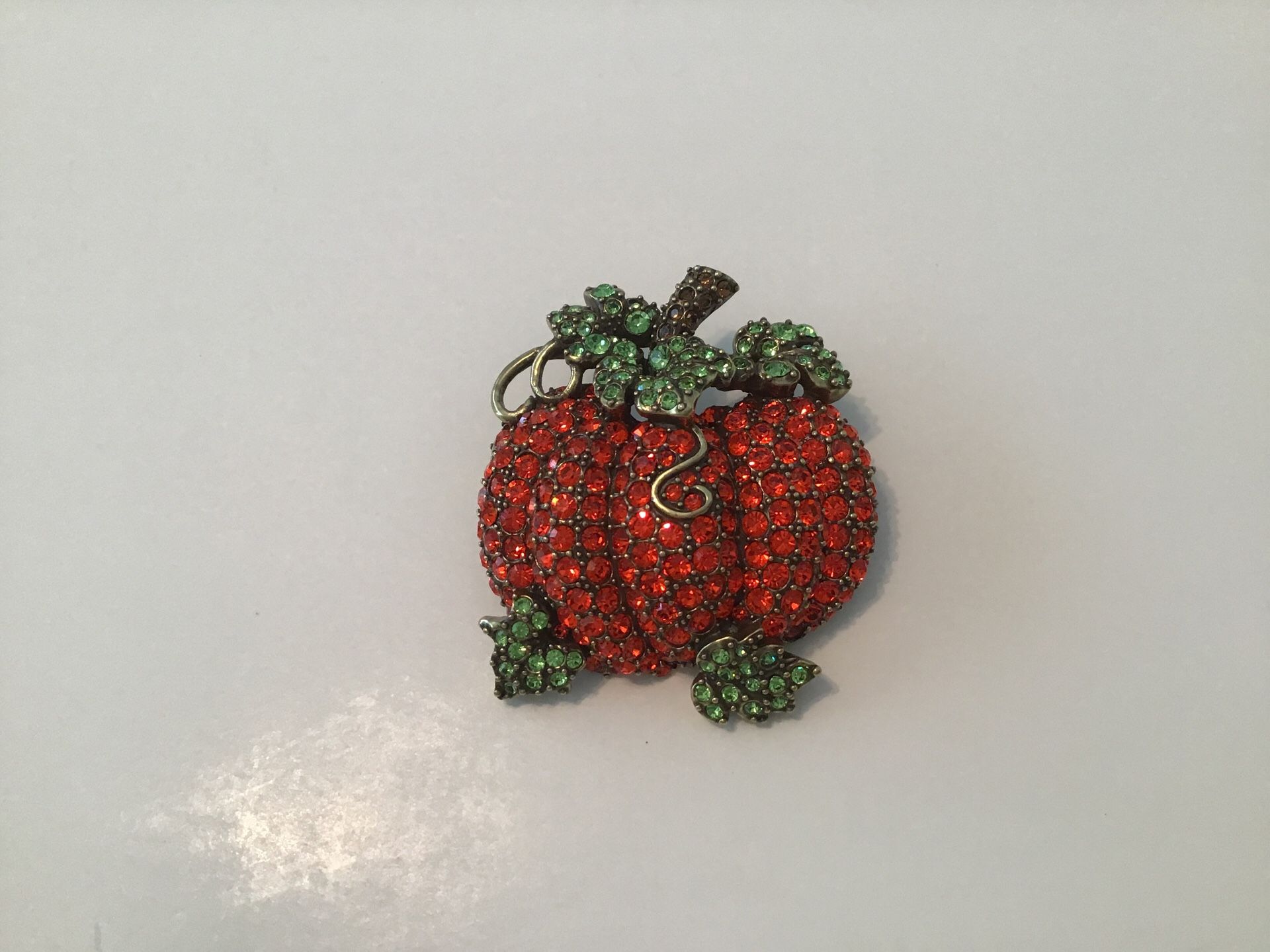 Multi color crystal antique gold tone. Pumpkin Brooch.