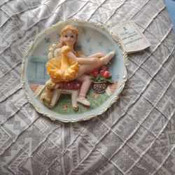 Ballerina Putting On Shoe