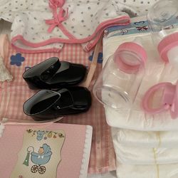 Baby doll, accessories, and clothing bottles