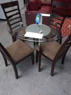 Round Glass dining table with 4 cushion wood chairs