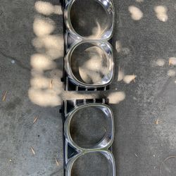 1967 Impala headlight Bezels.