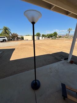 Floor lamp glass globe. Foot operated push button switch