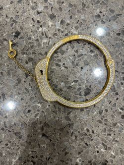 Handcuff bracelet gold over silver 600$