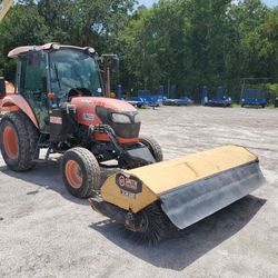 Tractor with Sweeper Broom Attachment