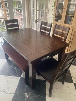 Table with chairs and bench