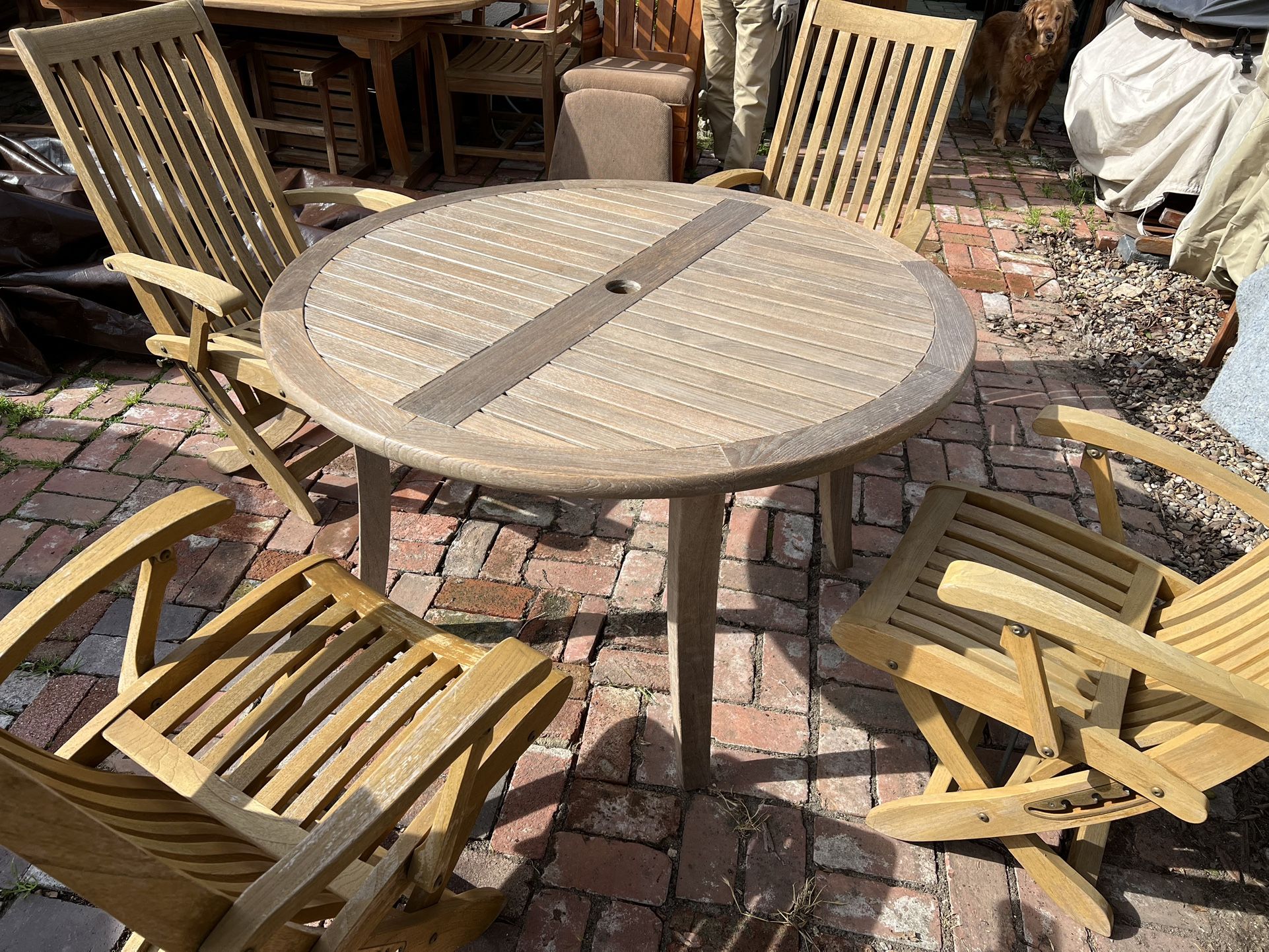 Vintage Smith And Hawken Teak Round Patio Table With 4 Folding Teak Chairs  Located in concord  Very good condition  Teak wood is heavy and sturdy  No