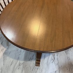 Circular Wood Dining Table with 5 chairs and 2 leaf inserts