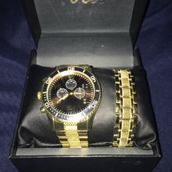 Gold And Black Watch And Bracelet