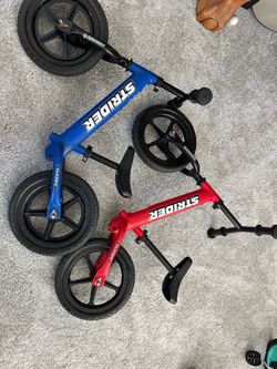 Red and blue Strider Toddler balance bikes,-please read description for prices