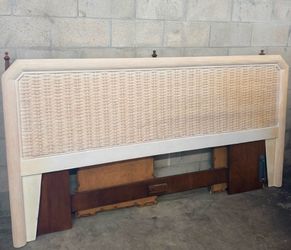 Coastal king-size headboard has a woven wicker center panel and a reeded wood frame.   87” x 47”h
