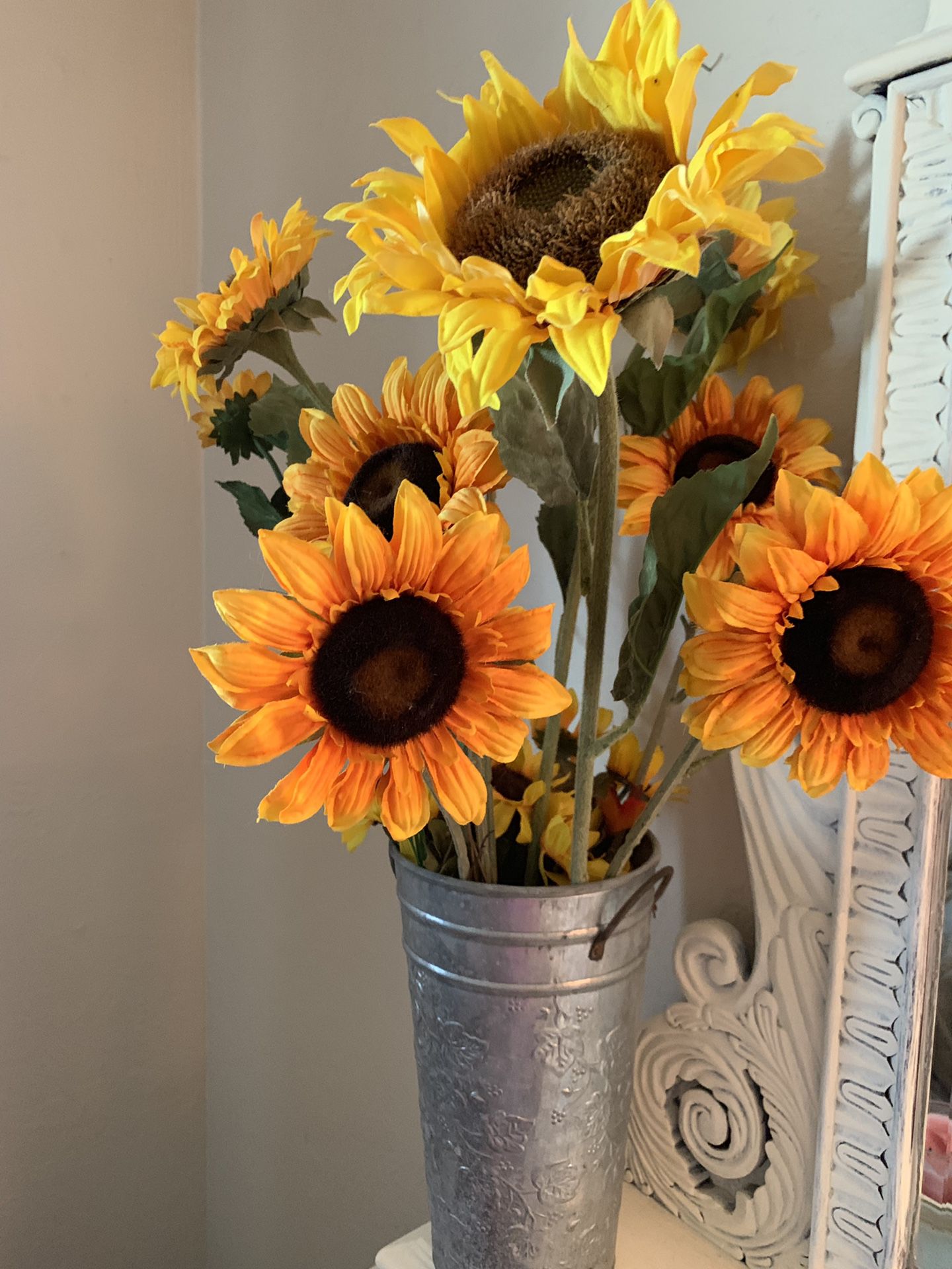 Sunflowers in tin bucket arrangement