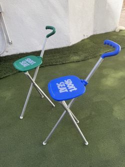 Set of 2 Sport Seat folding golf spectator chairs – one blue and one green.