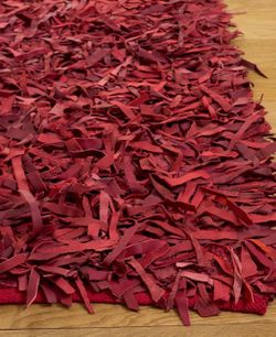 Leather  tassel  dark red rug