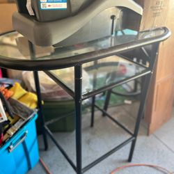 A Small Bar Table With Two Chairs