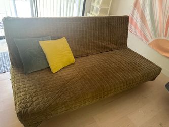 Futon sofa with velvet quilted cover